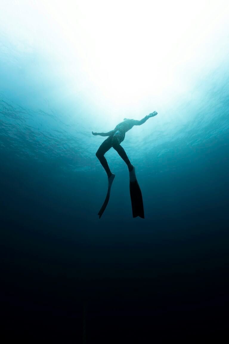 A freediver going towards the surface