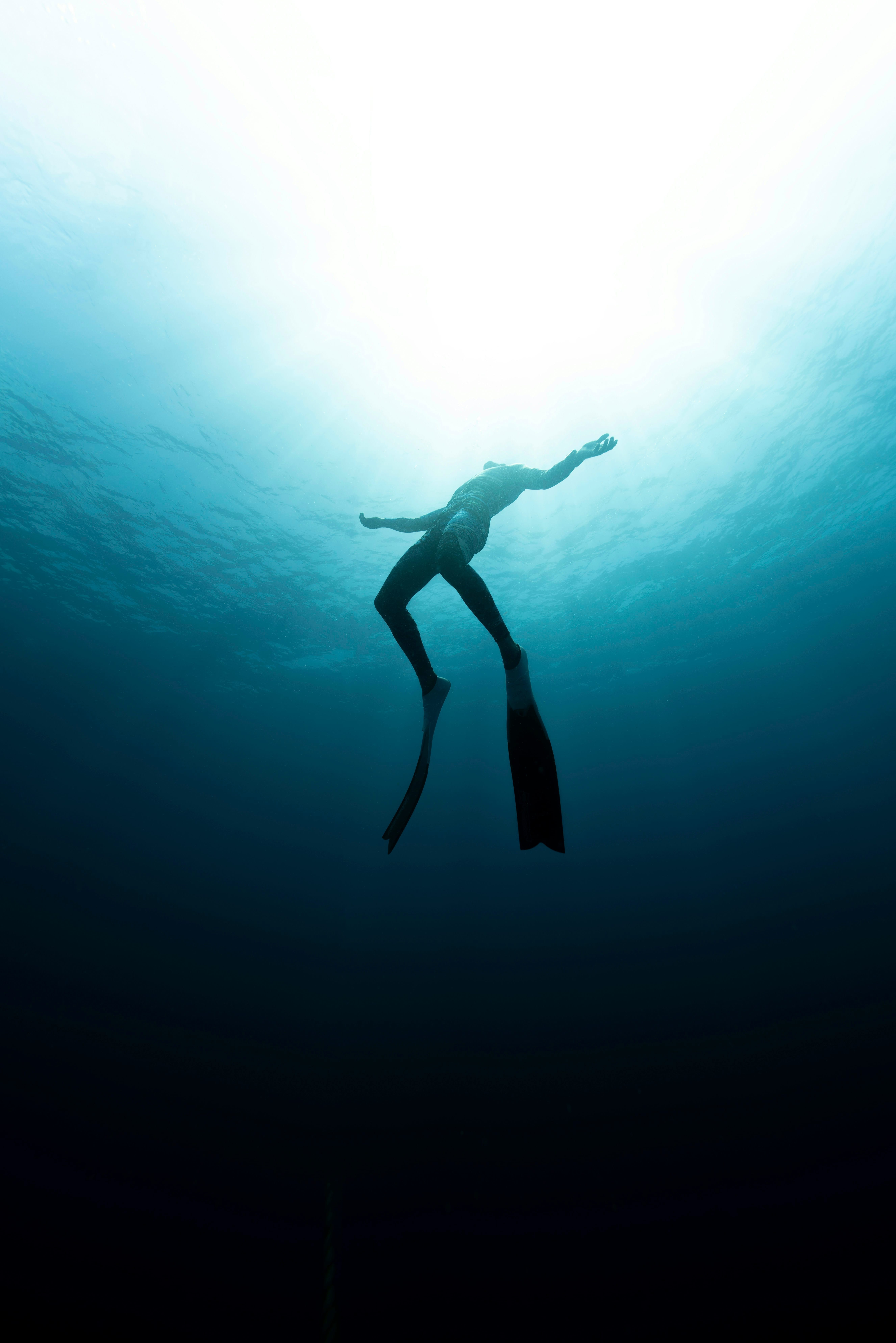 A freediver going towards the surface