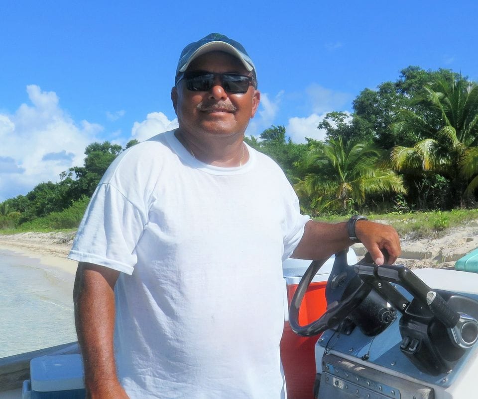 Carlos standing at the boat's command