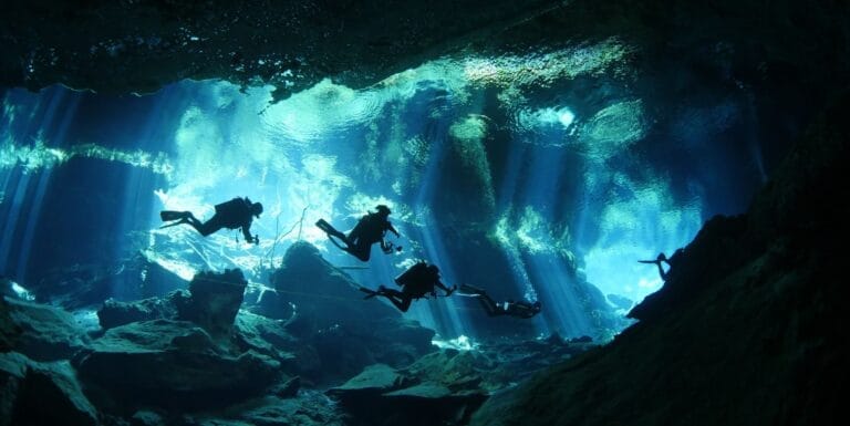 Divers exploring a cenote