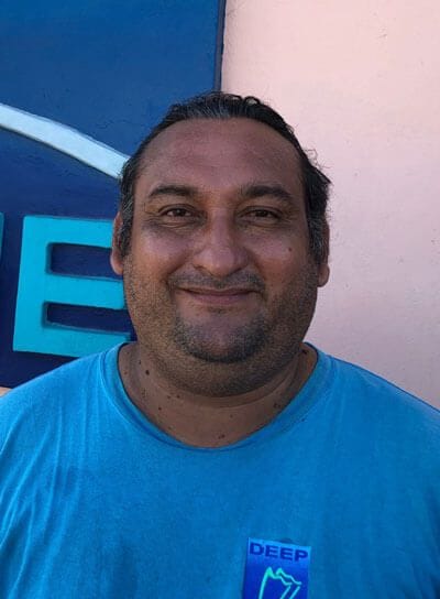 David standing in front of DeepBlue Cozumel shop