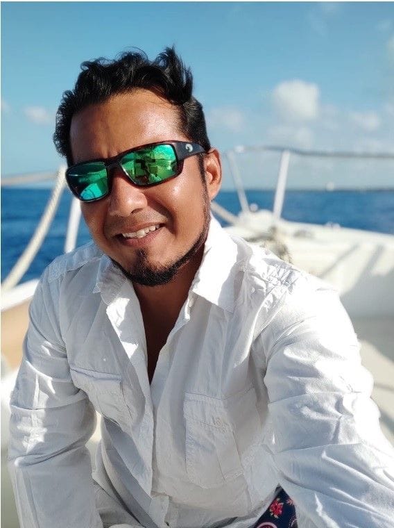 Julio with a smile on a boat