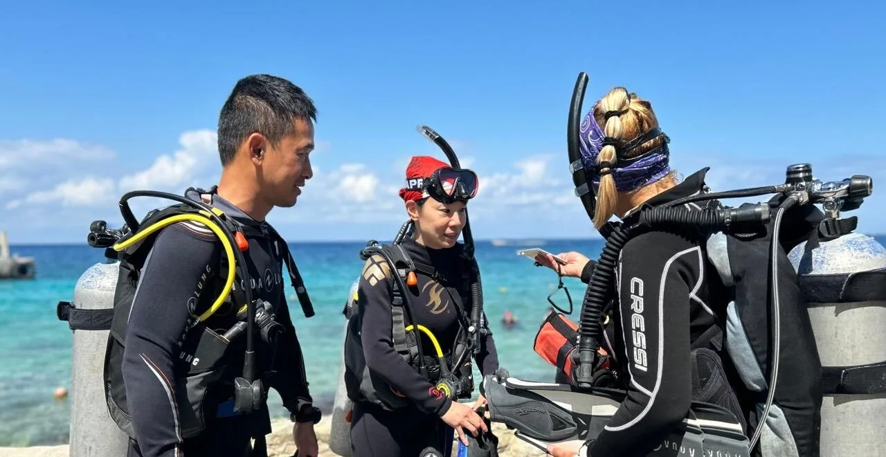 instructor and students on the beach